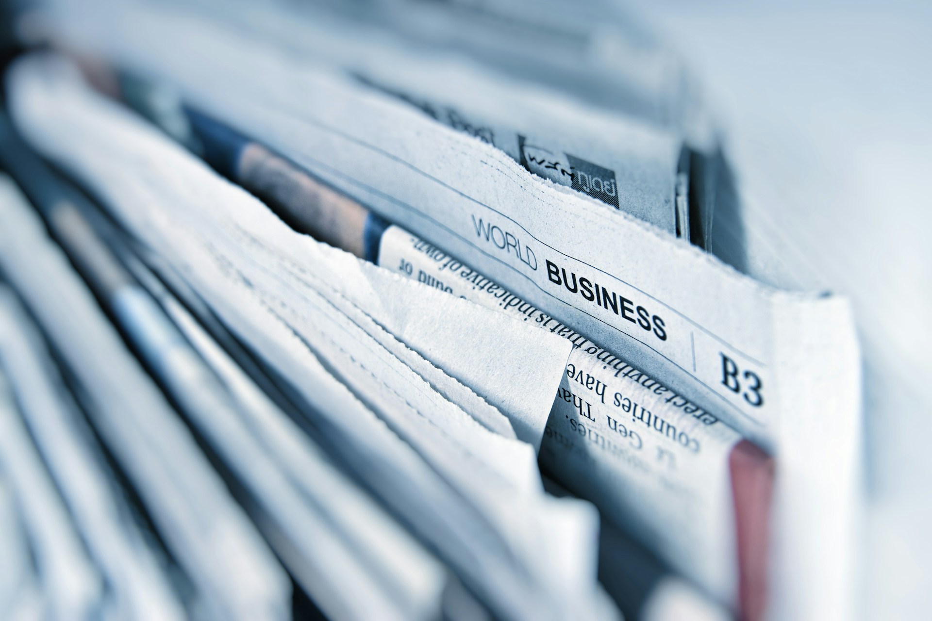 Data journalist at editorial desk with analytics display